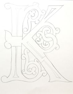 the letter k is drawn in pencil on paper