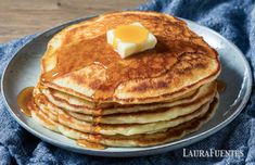 pancakes with butter and syrup on a plate