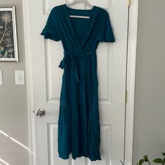 Has Tie Middle. Never Been Worn Ruffled Dress Teal Blue Summer Maxi Dress With Tie Waist, Blue Rayon Maxi Dress For Brunch, Blue Wrap Dress With Tie Waist For Brunch, Blue Maxi Wrap Dress With Tie Waist, Blue Tie Waist Wrap Dress For Spring, Blue Wrap Dress With Tie Waist, Blue Wrap Dress With Tie Waist For Spring, Blue Wrap Maxi Dress For Spring, Spring Blue Wrap Dress With Tie Waist