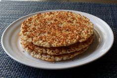 three crackers are stacked on a white plate