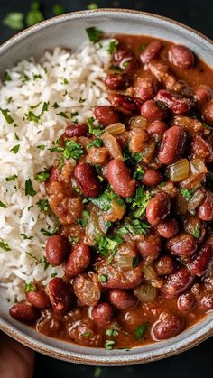 a bowl filled with beans and rice on top of a table