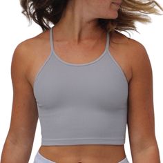 this free people american-made seamless cropped tank features a sporty racerback design. comfy lightweight compression rib fabric make this top perfect for layering with or without a bra. also available in white, army, black, navy + sandshell. details 92% nylon, 8% spandex machine wash cold size + fit model is wearing a size small Rib Fabric, Active Women, Ribbed Fabric, Athletic Women, American Made, Crop Tank, Lifestyle Brands, Basic Tank Top, Fitness Models