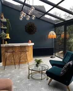 a living room filled with furniture and lots of windows