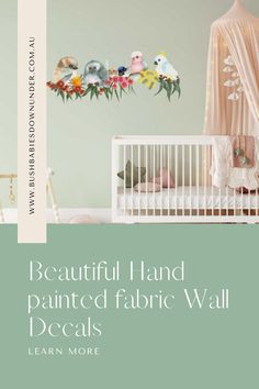 a baby's room with flowers and birds painted on the wall, along with a crib