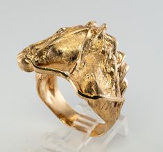 Horse Jewelry, 14K Gold Horse Ring, Equestrian Ring, Gold Ring, Horse Head Ring, Natural Diamond Ring, April Birthstone, Vintage Ring, Animal Ring, Unusual Ring, Estate Ring. This terrific Vintage ring crafted in highly desirable solid 14K yellow gold. This piece is very finely detailed! One white and fiery .03ct genuine diamond in the eye is SI1 clarity and G color. The presentation measures 24mm (1 inch) tall and is elevated 9mm from your finger. The ring weighs a very substantial 18.4 grams o Unique Yellow Gold Signet Ring For Collectors, Unique Yellow Gold Signet Ring Collectible, Elegant Gold Jewelry With Horse Design, Horse Rings, 14k Yellow Gold Jewelry With Horse Design, Equestrian Ring, Gold Horse Design Pendant Necklace, Horse Ring, Estate Ring