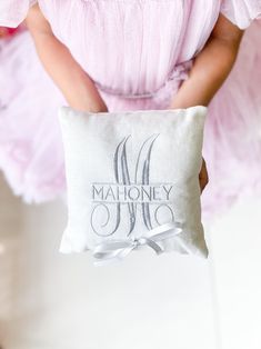 Introducing our exquisite Custom Embroidered Ring Bearer Pillow, a perfect accessory for your special day. This beautifully crafted pillow combines elegance and personalization to create a unique keepsake that will be treasured for years to come. Details of Listed Design: Fabric- Cream Linen Yarn Color- Dark Grey Ribbon Color- Light Grey Embroidered Ring bearer pillow to mark the most momentous occassion in ones life. ----------- D E T A I L S ----------- - Fabric Used- 100% Linen or Cotton Sateen Fabric - Ribbon- Comes with a Satin Ribbon of your choice - Filled- The pillow is filled up using poly fill and sealed shut - Size- Multiple sizes available for you to choose ------------------ CARE INSTRUCTIONS ------------------ - Machine Washable - Tumble Dry Low - Iron at cotton heat setting Ring Bearer Pillow Dusty Blue, Needlepoint Ring Bearer Pillow, Embroidered Wedding Ring Pillow, Ring Bearer Cushion, Embroidered Ring, Embroidered Ring Bearer Pillow, Wedding Ring Bearer Pillow, Grey Ribbon, Ring Bearer Pillows