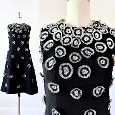 Fab vintage 60's mod black dress with metallic crochet embellishments! Adorned with very interesting and unique silver metallic embellishments (with a little bit of dark blue in the center). No fabric tag, but I believe it's a wool / polyester blend. Lined. No label. Back zip. Overall great vintage condition. Would best fit a modern size small (measurements below). Such a cool dress!  Measurements: Length -  Bust - Waist - Hip - NOTE: All items in my shop are vintage and pre-loved. Many have been around for 60+ years, which is pretty impressive if you ask me! Because of this, typical wear is expected. All items have been cleaned and are ready to wear, but some may still have a vintage-y odor. Please be sure to read all measurements and compare them to something in your wardrobe that fits y Mod Style A-line Party Dress, Vintage Black Embellished Dress, Fitted Mod Party Dress, Fitted Mod Style Party Dress, Unique Cocktail Dress, Unique Cocktail Dresses, Metallic Crochet, 60's Mod, Crochet Embellishments