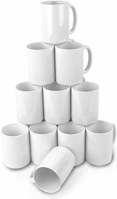 a stack of white coffee mugs sitting next to each other on a white surface