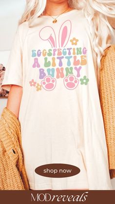 a woman with long blonde hair wearing a t - shirt that says, easter bunny shop now