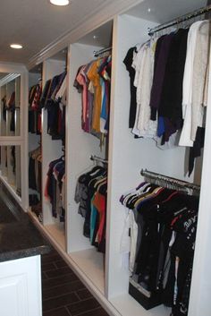 the closet is full of clothes and other items