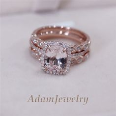 an engagement ring set with a cushion cut diamond in the center