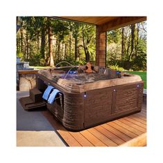 a hot tub sitting on top of a wooden deck