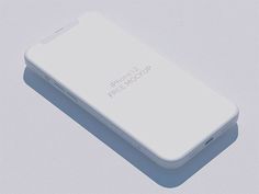 a white cell phone sitting on top of a gray surface with the text iphone 2 free mockup