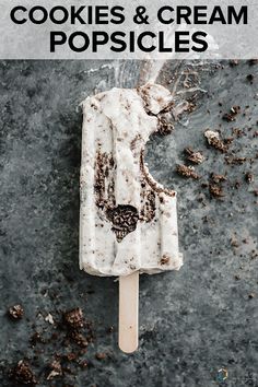 an ice cream popsicle with the words cookies and cream popsicles on it in front of