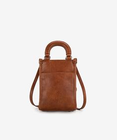 Made of synthetic leather Floral tooled with hand coloring A zippered pocket on the front of the small crossbody bag Top button closure An open pocket on the back Adjustable and detachable shoulder strap(Drop: 25.5"-29") 5.3"(L) x 3"(W) x 7.5"(H) Interior Capacity: Extra Small Brown Rectangular Phone Bag With Adjustable Strap, Brown Shoulder Phone Bag With Adjustable Strap, Brown Satchel Phone Bag With Adjustable Strap, Brown Phone Bag With Adjustable Shoulder Strap, Brown Phone Bag With Adjustable Strap, Brown Satchel Phone Bag For Everyday Use, Brown Phone Bag With Detachable Strap For Travel, Brown Phone Bag With Removable Pouch, Brown Phone Bag With Cell Phone Pocket For On-the-go