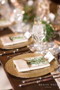 the table is set with place settings and silverware