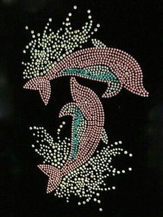 a black background with pink and blue designs on it's side, in the shape of two fish