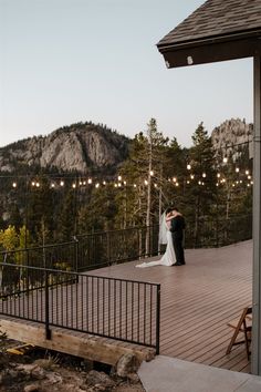 A bride and groom dance beneath bistro lights before a mountain backdrop at sunset. December Mountain Wedding, Classic Mountain Wedding, Rocky Mountains Wedding, Mountain Home Wedding, Mountain Intimate Wedding, North Star Gatherings Wedding, Mountain Wedding Venues Tennessee, Destination Wedding Montana, Woodsy Mountain Wedding