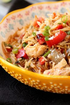 a yellow bowl filled with rice and vegetables