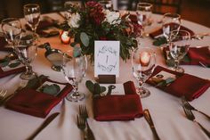 the table is set with silverware, napkins and place settings for an event