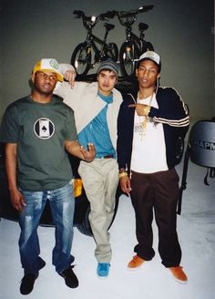 three young men standing next to each other