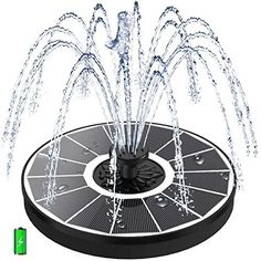 a fountain with water spouting out from it's center and two jets on top