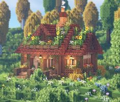 a house in the middle of a forest with flowers growing on it's roof