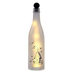 a light up bottle with a drawing on it