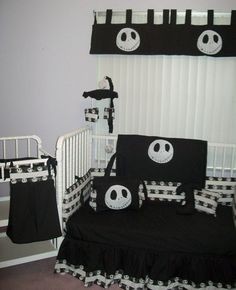 a black and white crib bedding set with jack skellingy faces on it