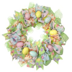 an easter wreath with colorful eggs and bows