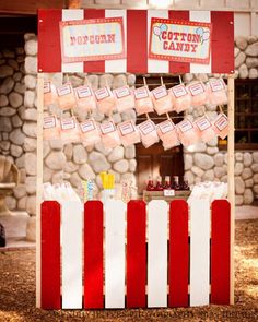 a carnival booth with candy and cotton candy