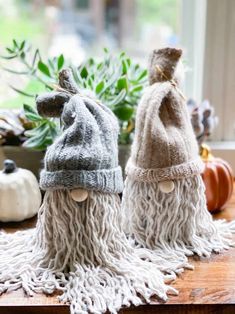 two knitted gnomes with text overlay that says diy gnomes using mops