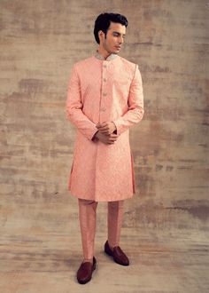 Featuring this Peach Budcolour Sherwani in Resham embroidery. This Sherwani set is fully embroidered with ivory colour Resham and collars and buttons are hand-embroidered in silver colour. It can be paired with churidaar as well. Perfect fit for any wedding function. Brand: Panache Haute Couture Availability: Online and In-store Delivery Time: 4-6 Weeks Fabric: Sherwani - Silk and Bottom (Churidaar) - Lycra Satin or Trouser - Raw Silk Customisation: For more colour options please contact our tea Chanderi Sherwani With Resham Embroidery, Semi-stitched Silk Sherwani With Resham Embroidery, Embroidered Yellow Chanderi Sherwani, Peach Sherwani, Semi-stitched Embroidered Raw Silk Sherwani, Wedding Function, Thread Work, Slim Pants, Ivory Color