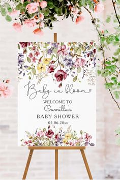 a sign with flowers on it that says baby in bloom