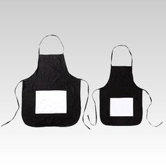 two black and white aprons one has a square patch on the front, while the other has a rectangular patch on the back