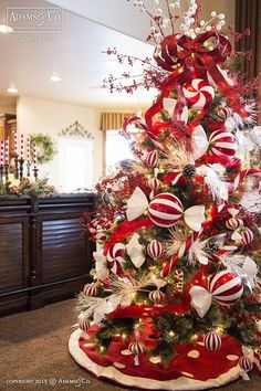 a christmas tree decorated with red and white ornaments