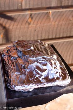 a piece of tin foil sitting on top of a grill