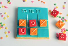 a cookie that has been decorated to look like tic - tacquets