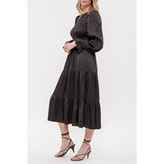 The August Sky Women's Smocked Body Long Sleeves Midi Dress combines elegance and comfort. It features a round neckline with a behind-the-neck button and keyhole for a delicate touch. The smocked bodice provides a flattering and snug fit, complemented by a tiered skirt that adds graceful movement. Constructed from satin-like fabric, this dress has a luxurious feel and is fully lined to ensure comfort and coverage. Perfect for any special occasion, this midi dress effortlessly enhances your style Black Dress With Smocked Back For Work, Black Midi Dress With Smocked Back For Fall, Elegant Black Midi Dress With Smocked Back, Wedding Guest Dress Midi, Short Tunic, Graceful Movement, Maxi Slip Dress, Knit Midi, Long Sleeve Midi