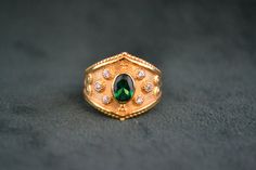 An amazing byzantine ring made with solid sterling silver (925 silver) that has 22k gold plating. It is enriched with Emerald cubic zirconia and white cubic zirconia. Byzantine Gold Emerald Ring For Anniversary, Byzantine Gold Emerald Anniversary Ring, Byzantine Ring, Byzantine Rings, Greek Ring, Ring With Emerald, Plated Ring, Jewelry Ring, Ring Vintage