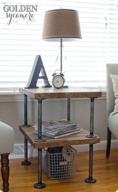 a small table with a lamp and some books on it in front of a window