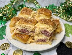 a white plate topped with pastries on top of a green table cloth next to shamrocks