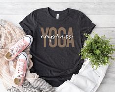 Yoga Empress Shirt, Yoga Tshirt, Meditation Tshirt, Namaste Shirt, Gift for Yogi, Women Yoga Shirt, Positive Shirt, Yoga Outfit, Yoga Shirt ⭐Production Time 1-3 Business Days ⭐Shipping Time 1-5 Days for U.S. Orders. ⭐ Sizing & Color info in the PHOTOS section of every listing.       -All normal listings are Adult Unisex. ⭐ Bella & Canvas Adult Unisex T-Shirts:        - Solid Colors are 100% Soft Cotton        - Heather Colors are Soft Blended Fibers ⭐HOW TO LOVE YOUR TEES:       -Wash inside out with like colors.       -Tumble dry low or hang to dry.       -Try not to iron directly over the design. Also, don't iron t-shirts! Athleisure Stretch T-shirt With Letter Print, Stretch Sports T-shirt With Text Print, Comfortable Pre-shrunk Workout T-shirt, Sporty Yoga T-shirt With Letter Print, Stretch Athleisure T-shirt With Letter Print, Pre-shrunk Stretch Sports T-shirt, Comfortable Athleisure T-shirt With Letter Print, Sporty Letter Print T-shirt For Yoga, Comfortable Athleisure Letter Print T-shirt