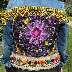 Lotus Jacket, Embroidered Purple Lotus Jacket, Kuchi Beaded Belt, Multi Color Pom Pom Belt, Kuchi/Banjara Belly Dance Belt Jacket Boyfriend Style Denim Jacket. -Embellished Soft Blue Denim Jacket With Kuchi/Banjara Patches Imported From India And Pakistan -Patches Hand Sewn All On The Back And Continue To Shoulders/Sleeves. -Classic Blue Denim Jacket. -Condition: Brand New. -Size: L (Jr) Fits Women S/M Or Junior L -Materials: Denim Jean Jacket, Beads, Colorful Pom Poms, Studs, Kuchi Belt Bohemian Embroidered Blue Denim Jacket, Bohemian Blue Embroidered Denim Jacket, Blue Embroidered Long Sleeve Denim Jacket, Embroidered Multicolor Denim Jacket, Multicolor Embroidered Denim Jacket, Blue Long Sleeve Denim Jacket For Festival, Bohemian Embroidered Multicolor Denim Jacket, Embroidered Multicolor Denim Jacket For Fall, Festival Denim Jacket With Floral Embroidery