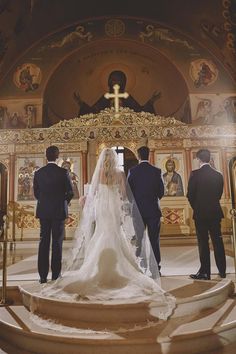 the bride and groom are getting ready to walk down the aisle at their wedding ceremony