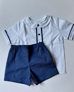 Beautiful toddler outfit, custom made by hand for a littler boy. It will be made with white and navy blue cotton fabrics. Top has blue trims at front and on its sleeves to enhance the set. Made with nice quality 100% cotton fabrics Very comfortable, set includes Shirt and Short. Cotton School Uniform Sets, Classic Blue Short Sleeve Set, Navy Cotton Playtime Sets, Cotton Navy Sets For Playtime, Baby Boy T Shirt, Outfit Elegant, Baptism Outfit, Beige Shorts, Cake Smash Outfit