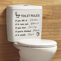 a toilet with the words toilet rules written on it