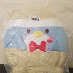 a stuffed animal is wrapped in plastic