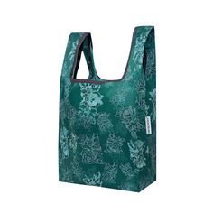 a green shopping bag with flowers on it