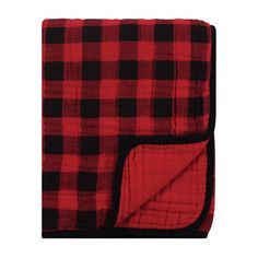 a red and black plaid blanket on a white background